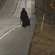 Illustration for article titled Mysterious Woman in Black Walking Across the South Finally Made It